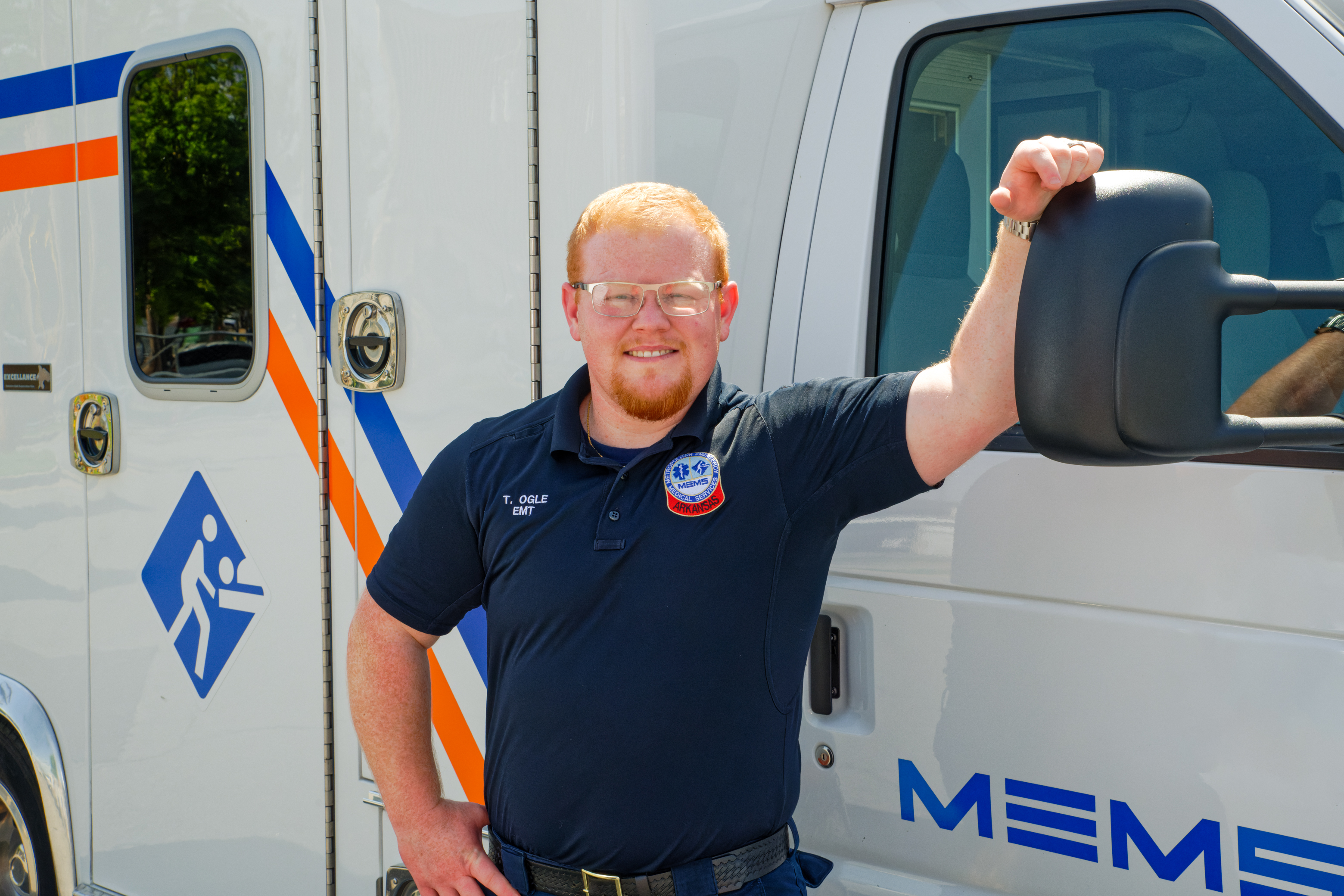 Paramedic Student next to ambulance